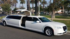 white Chrysler stretch limo hire in Melbourne waiting for customers