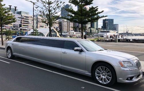 silver color Chrysler stretch limo hire in Melbourne Docklands waiting for customers